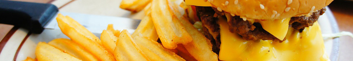 Eating American (Traditional) Burger Sandwich at Big Top Delicatessen restaurant in Brunswick, ME.